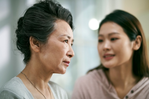 Two women have a serious moment.